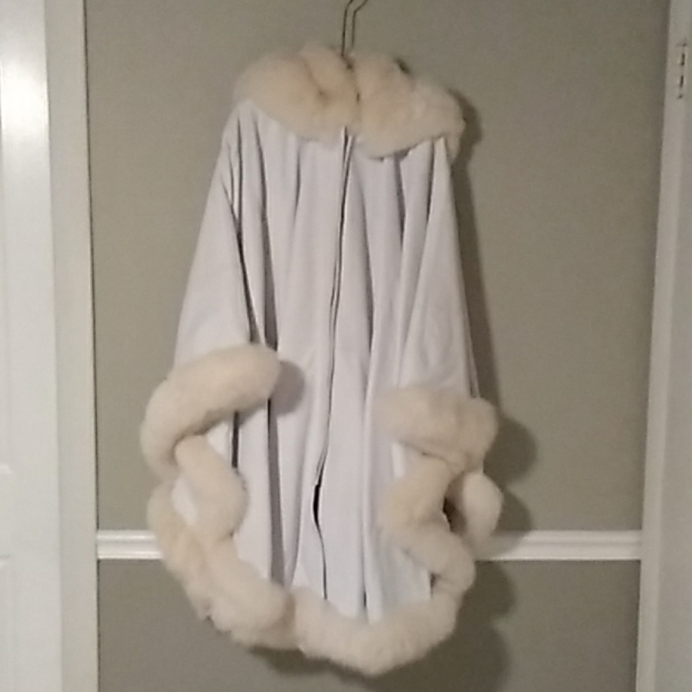 Coat, glamorous, leather with Fox trim.